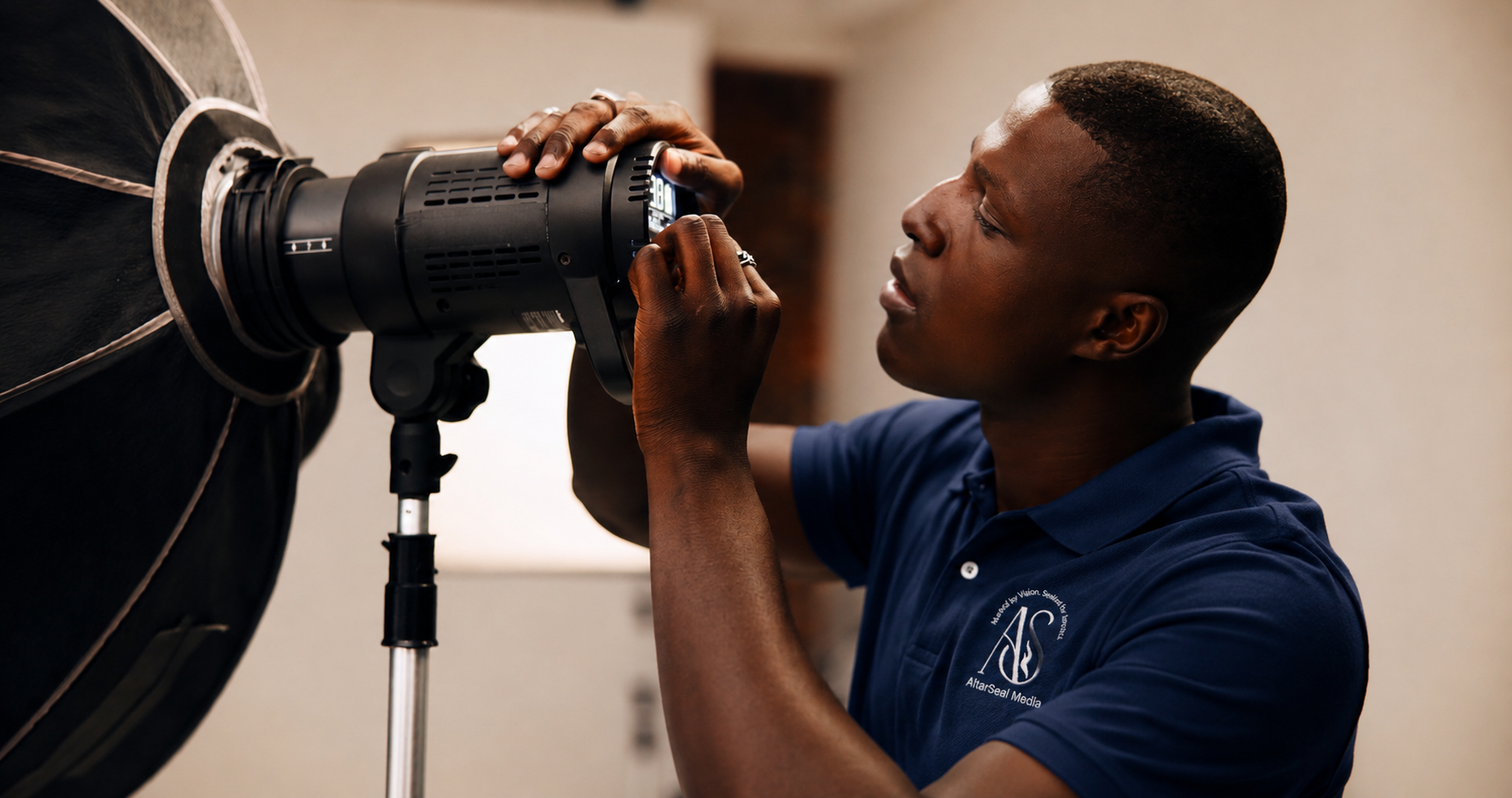 Photographer Adjusting Studio Light